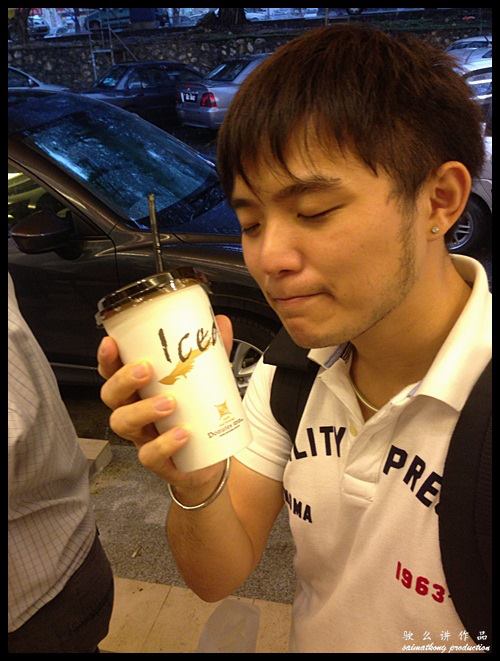 Me holding a cup of Iced Cappucino - aromatic and the texture was good. Lovin