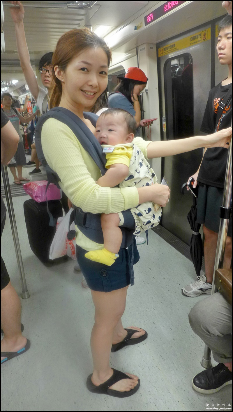 When I travel, I prefer babywearing instead of pushing the stroller through a crowded metro station and onto a train.