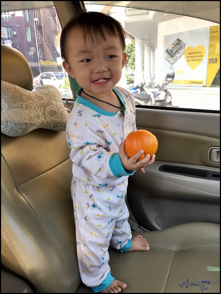 Aiden holding orange