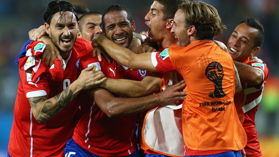 Jean Beausejour of Chile (C) celebrates scoring his teams third goal with teammates (Photo by Clive Brunskill/Getty Images)