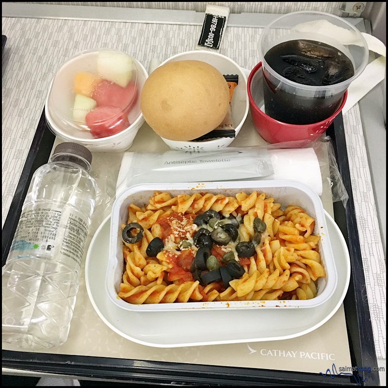 Our in-flight meal. I had the braised chicken with potatoes and white fungus rice while the wife had the pasta. 