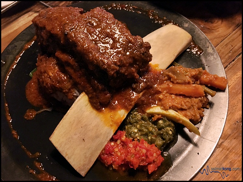 Naughty Nuri’s - The Notorious Short Ribs is braised beef short ribs with their special Rendang sauce served with onion rice and acar.