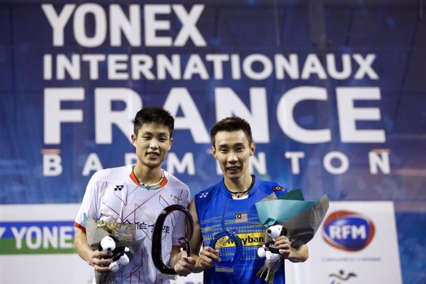 French Open winner Lee Chong Wei (right) posing for a picture with runner-up Chou Tien-chen of Taiwan after the prize giving ceremony on Sunday. - EPA