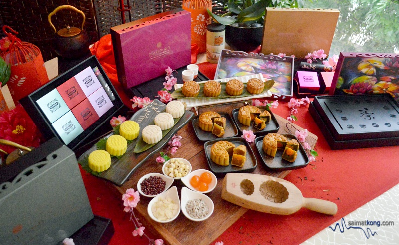 Mooncake display featuring varieties of traditional baked and snowskin mooncakes offered by Pullman Kuala Lumpur Bangsar.