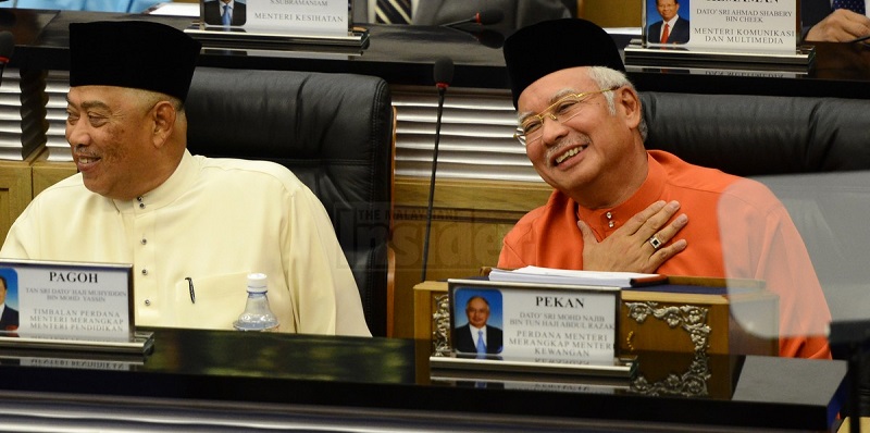 Prime Minister Datuk Seri Najib Razak and his deputy Tan Sri Muhyiddin Yassin having a light moment just before the Budget is tabled.
