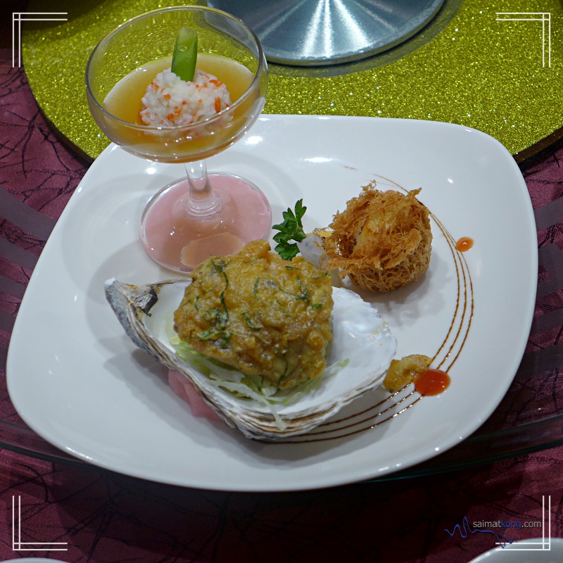 Fabulous trio of stuffed oyster, scallop on a bed of banana and crab island