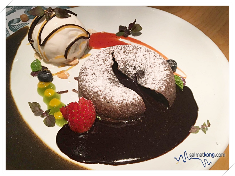 Lou Hei your way into the New Year @ Delicious Restaurant - This warm chocolate cake is filled with gooey, liquid chocolate inside, dusted with powdered sugar and served with a dollop of vanilla ice cream. 