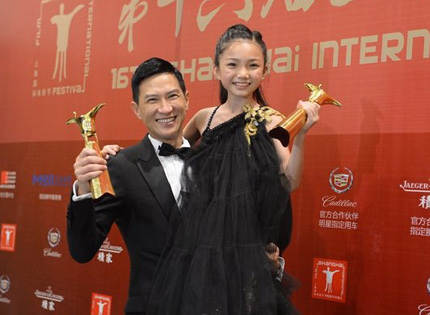 Hong Kong actor Nick Cheung celebrates winning the best actor award at the Shanghai International Film Festival for his portrayal of a broken man who was once a boxing champion in the Hong Kong film 